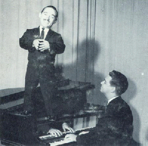 Lowell Mason standing atop piano