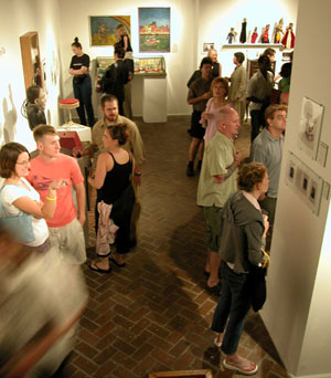 Visitors enjoying Jeffrey Gordon's Johnny Eck collection